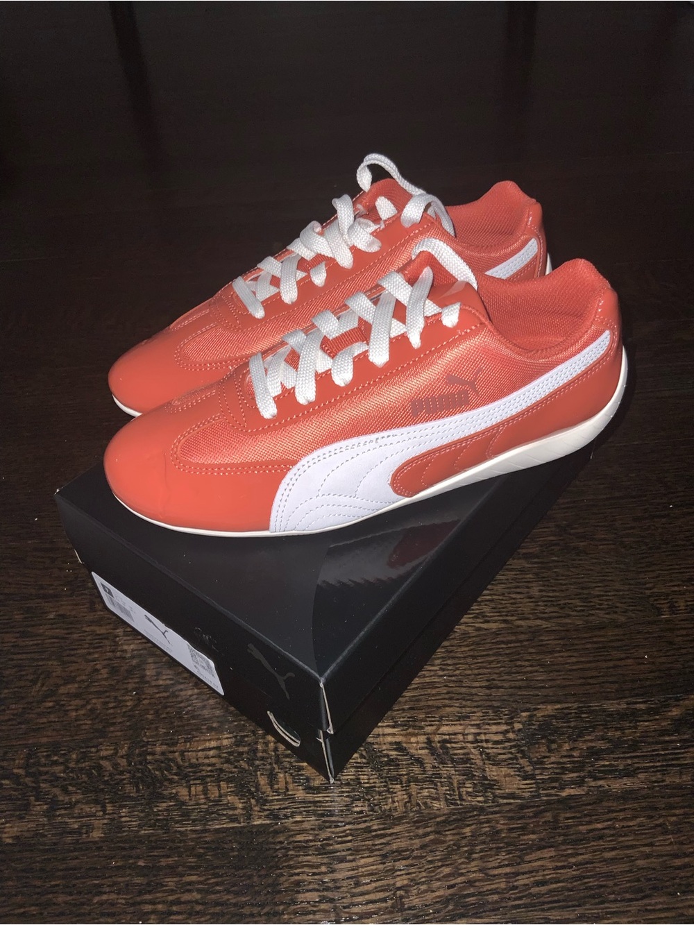 Puma woman’s Coral-Orange Sneakers with White Formstrip